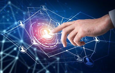 Human hand point in the center of social network icons.