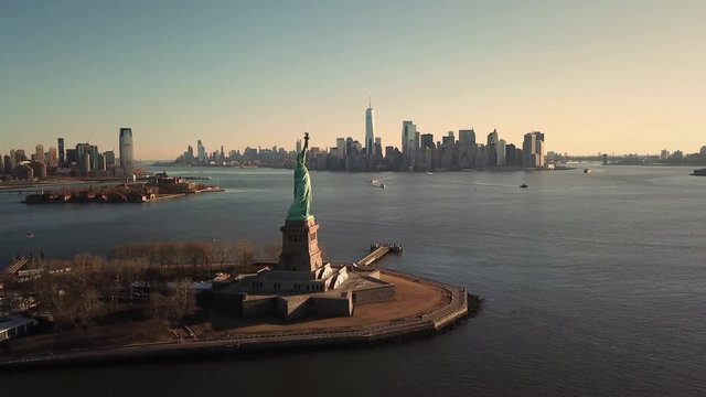 Statue Of Liberty Aerial Moving Forward over Water Toward Manhattan New York City Skyline 4K and 1080 HD NYC
