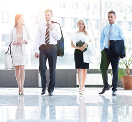 business people standing in the lobby of the modern office.