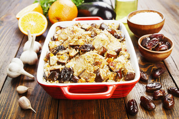 Chicken thigh baked with rice, eggplant and figs