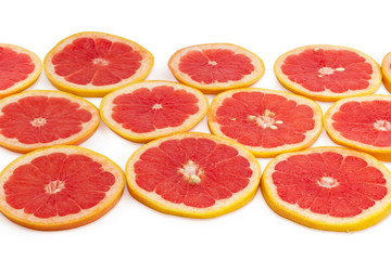 Round slices of the red grapefruit at selective focus