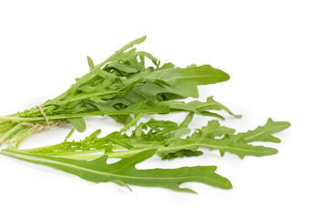 Fototapeta premium Leaves of the fresh arugula closeup on a white background