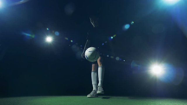 Football soccer palyer preforms impressive dribbling tricks.