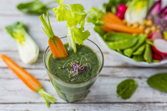A delicious and healthy green smoothie in glass.
