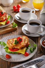 Sandwich of croutons with coffee and orange juice.
