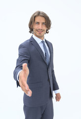 Smiling friendly businessman offers a handshake