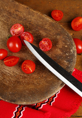 knife and cherry tomatoes