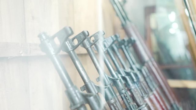 Museum display of automatic assault rifles from Vietnam war at Cu Chi Tunnels in Southern Vietnam - m16 and ak47