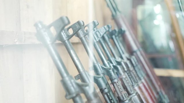 Display case featuring M16 american rifles from Vietnam War Jungle combat