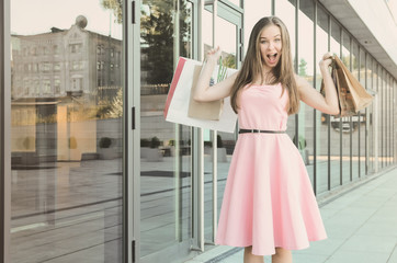 Attractive woman after shopping with purchases
