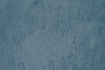 Beautiful blue stone background - surface of polished marble with sunlight reflections