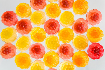 Mosaic of colorful fruit chewing marmalade.