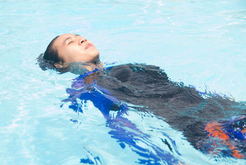 Asian woman swimming pool