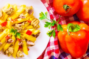 plate of macaroni with meat and tomato
