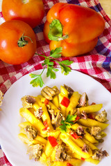 plate of macaroni with meat and tomato