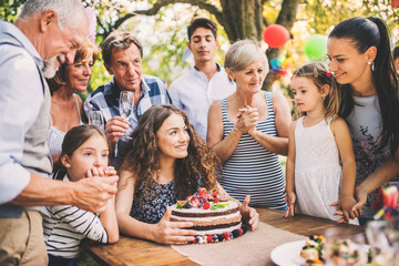 Family celebration or a garden party outside in the backyard.
