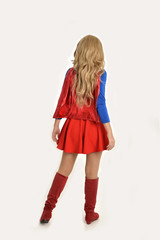 full length portrait of pretty girl wearing super hero costume, standing pose, isolated on white studio background.
