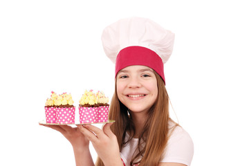 Happy little girl cook with muffins dessert