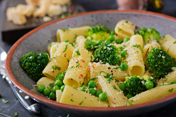 Pasta rigatoni with broccoli and green peas. Vegan menu. Dietary food