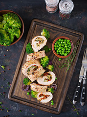 Chicken roll with stuffed sun-dried tomatoes and cheese. Flat lay. Top view