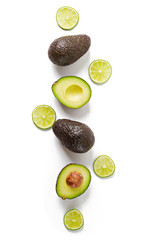Avocado and lime isolated on white background. Top view