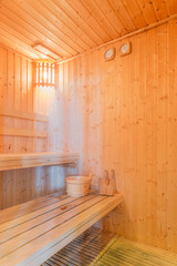 Fototapeta na wymiar Spa or wooden Sauna steam room interior for healthy and relaxation