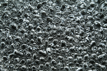 Boiling water against black background