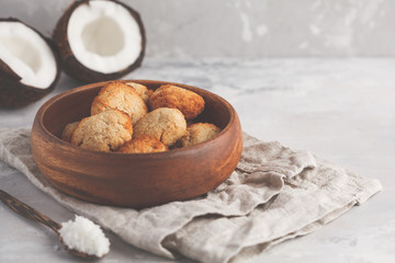 Healthy vegan homemade coconut cookies in wooden bowl, light background. Healthy vegan food concept.