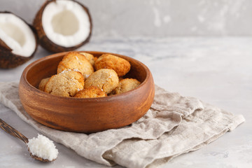 Healthy vegan homemade coconut cookies in wooden bowl, light background. Healthy vegan food concept.