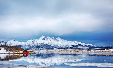 Beautiful winter landscape of picturesque red rorbu in the Lofoten islands