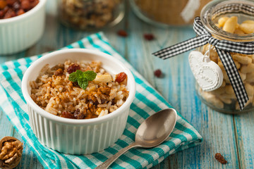 Traditional, mexican baked sweet rice, with almonds, raisins and walnuts.