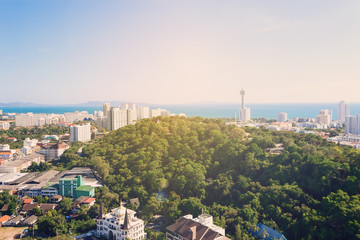 Fototapeta na wymiar Thailand aerial high view point from Pattaya Unixx condo: park, ocean beach and condominiums. Relax background for meditations. Downtown with blue clear sky. Sunny day