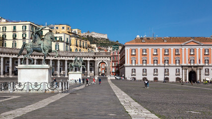 Fototapeta na wymiar Naples (Italy) - Piazza Plebiscito, the main square in the historic centre of Naples. Two equestrian statues 