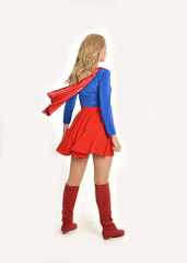 full length portrait of pretty girl wearing super hero costume, standing pose, isolated on white studio background.