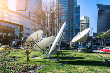 satellite dish antennas with modern office building