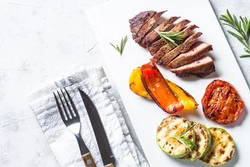 Foto op Canvas Beef steak and grilled vegetables. top view. © nadianb