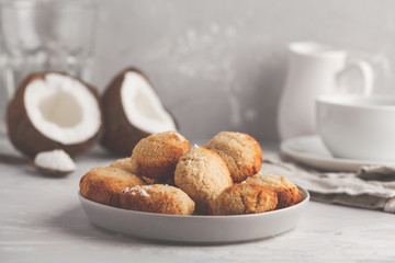 Healthy vegan homemade coconut cookies with tea/coffee, light background. Healthy vegan food concept.