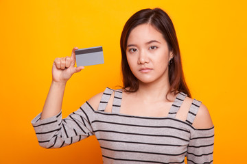 Young Asian woman with a blank card.