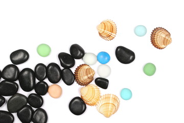 Black and colorful pebbles, rocks with sea shells isolated on white background, top view
