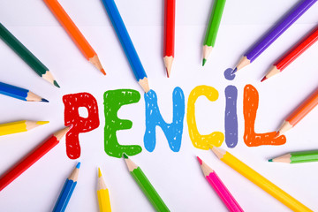  Colorful pencils isolated on white background. Top view with colored pencil caption. With copy space