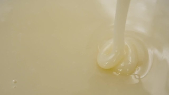 Pouring Sweetened condensed milk. Slow motion