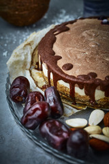 Chocolate vegan cake with different nuts, dates and carob