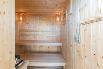 Fototapeta na wymiar Spa Sauna steam wooden room interior for healthy and relaxation
