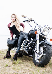 Fototapeta na wymiar Pretty biker woman outdoor