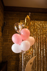 A lot of pink, white and golden balloons on the Birthday party. Decoration