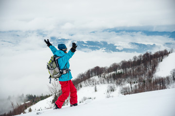Young woman on the snowboard