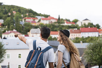 Fototapeta premium Two young tourists with camera in the old town.