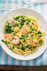 Creamy king prawn tagliatelle with pea, spinach and sweet corn 