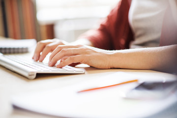 Businesswoman in wheelchair at the desk in her office.