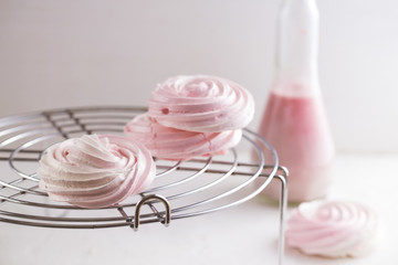 Raspberry meringue on concrete desk. Space for text. Close up view. Romatic wedding. 